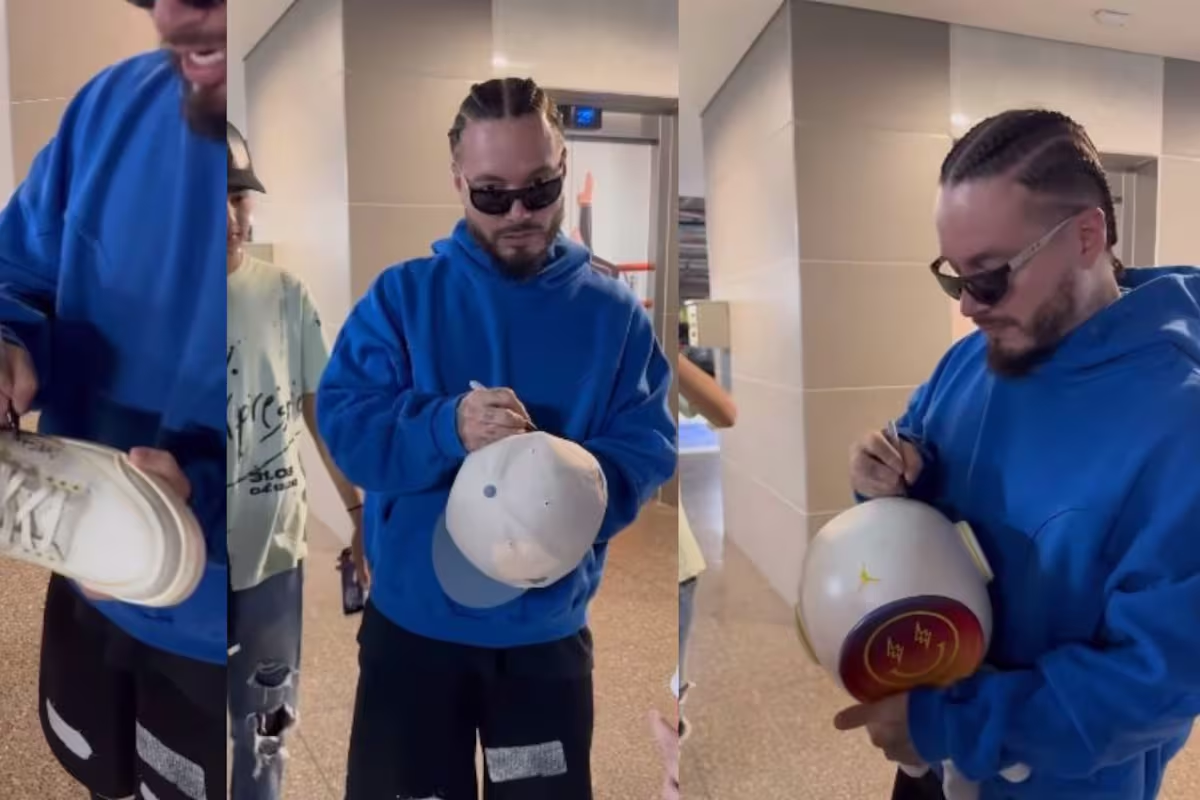 J Balvin complace a sus fans y firma de todo, hasta tenis